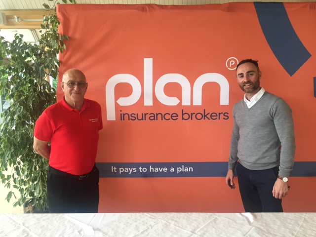 Taxi Driver of the Year Golf Day 2017 Plan Director and TDOY organiser in front of Plan Logo